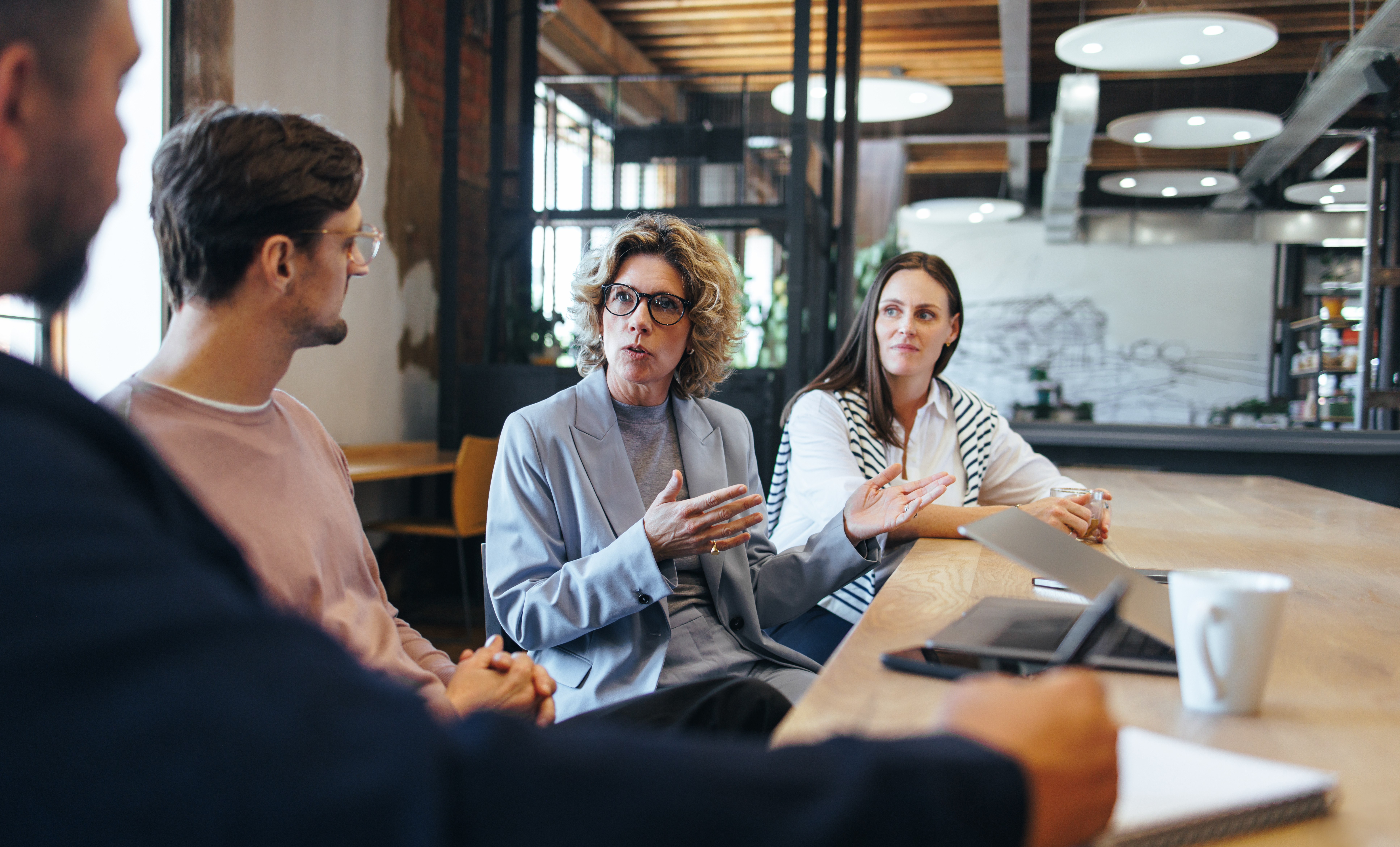 Business people having a discussion over a project in an office