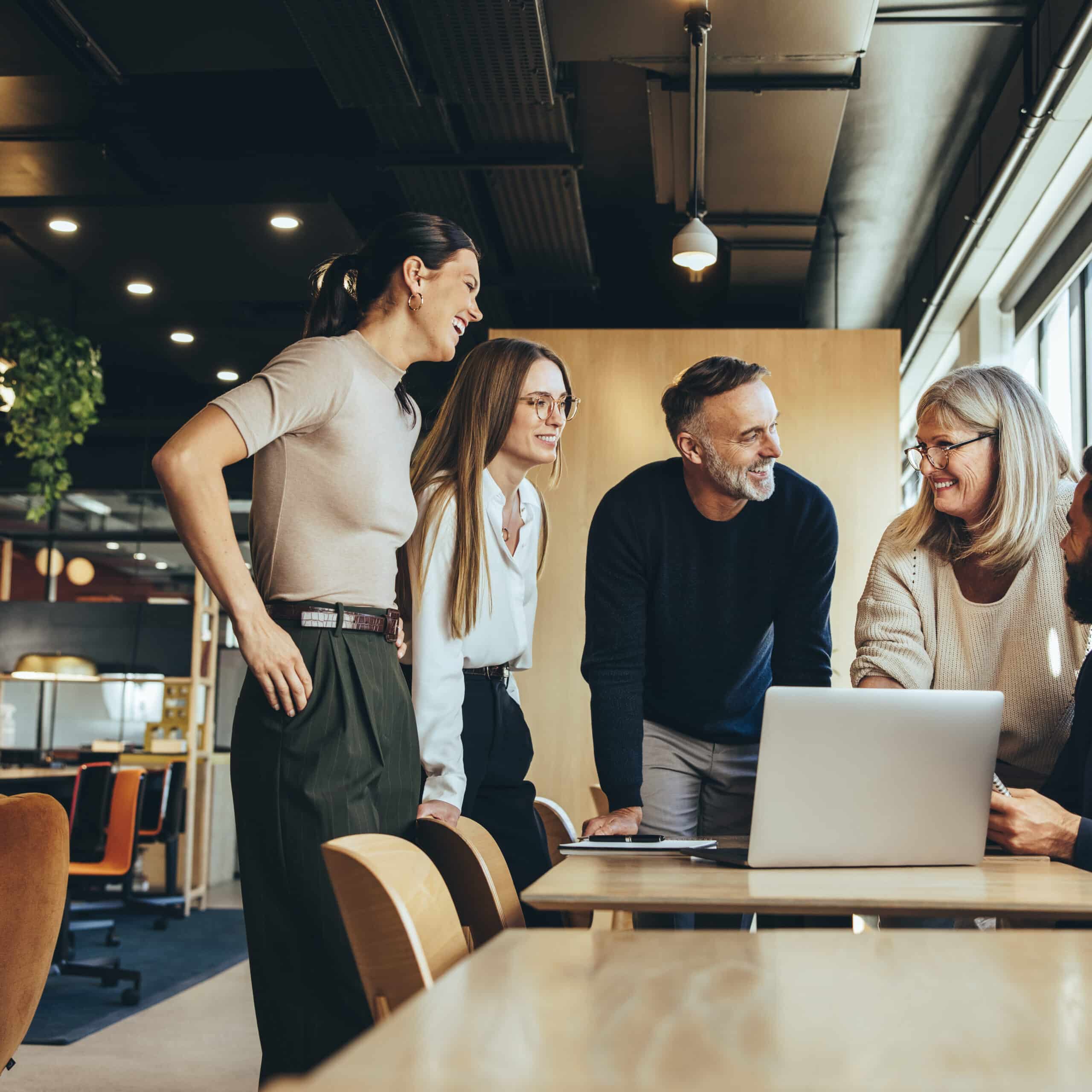 Smiling businesspeople having a discussion in an office