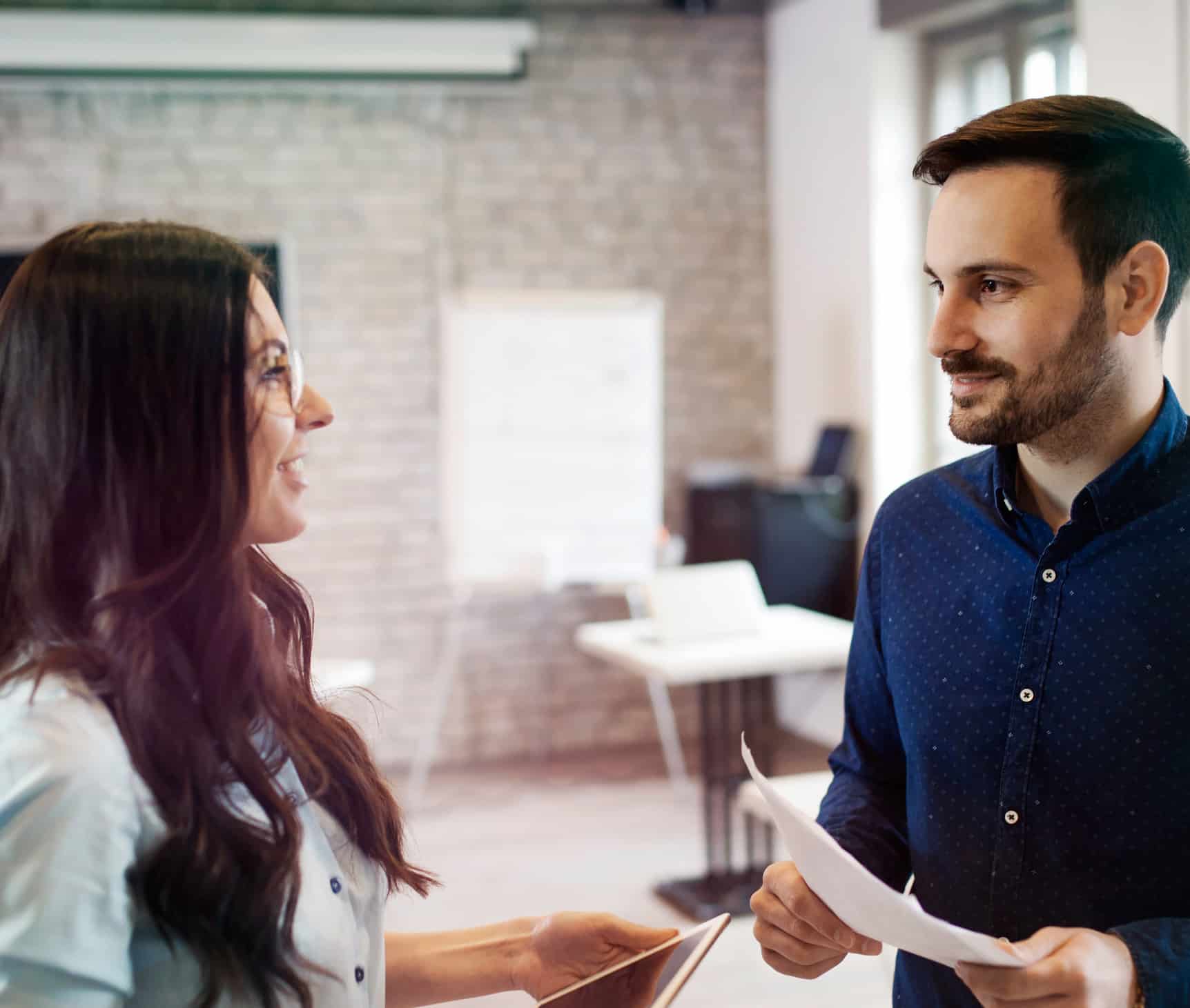 Picture of young designers discussing in office